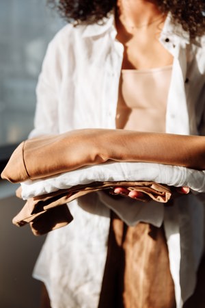 woman holding clothes