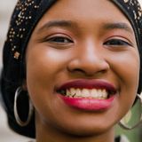 woman in black hijab with red lipstick