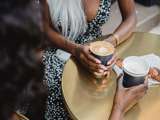 black women holding coffee